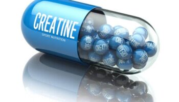 Creatine capsiule isolated on white background.