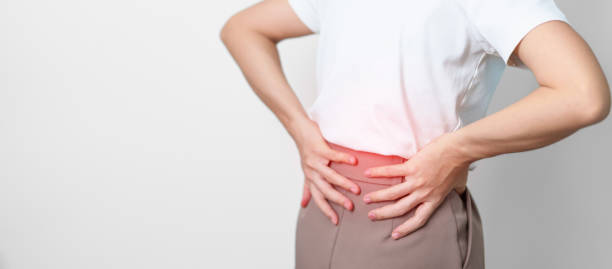 adult female with muscle pain on gray background.