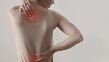 woman experiencing back pain with perimenopause